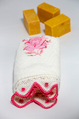 Towel with lace. Natural soaps at the back.