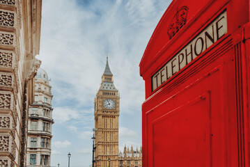 Fototapeta na wymiar London - Big Ben tower and a red phone booth
