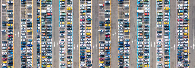 Empty parking lots, aerial view. A lot of cars in the parking lot. Colorful moody drone shoot.