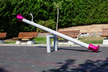 Empty seesaw on playground in public park