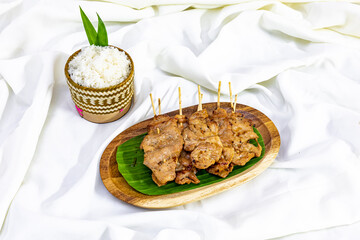 sticky rice with Grilled pork skewer  has a sweet taste.