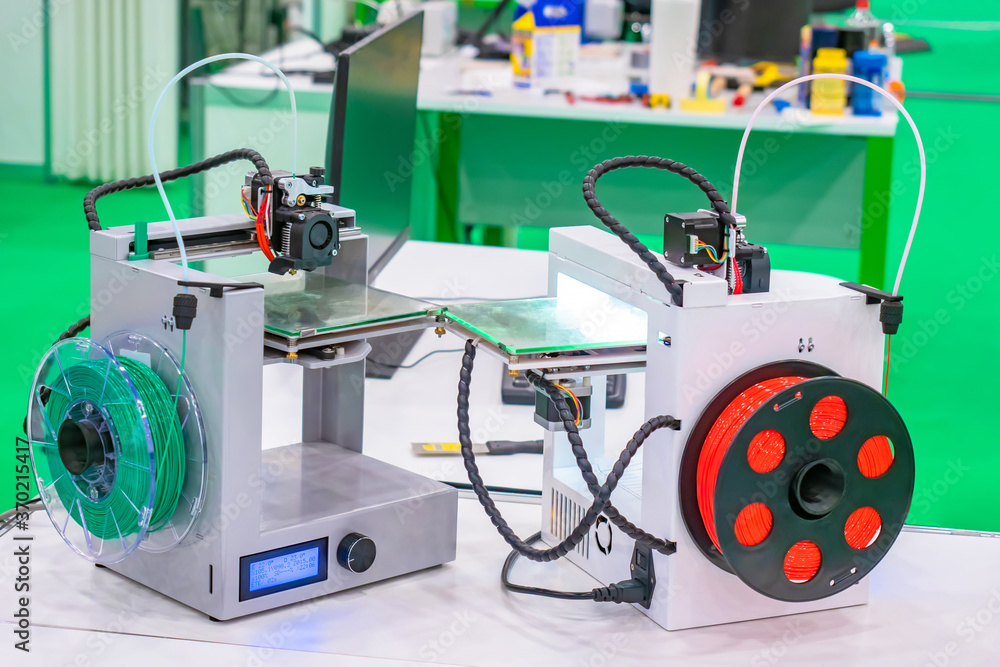 Poster 3d printers on the background of a technical laboratory. devices for printing three-dimensional imag
