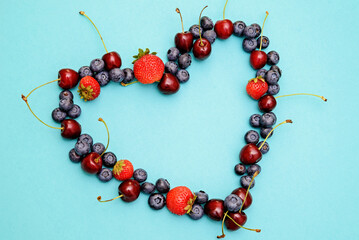 Different berries photography , heart shape