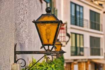 The typical lamps in a street of the fishing village Tossa de Mar. Costa brava (Catalonia)