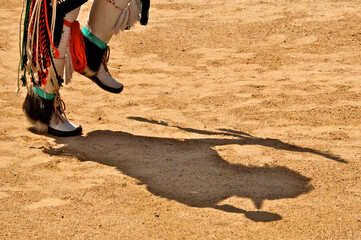 Shadow Dance. Shadow of dancer with rattle, bow and arrow, Indian Pueblo Cultural Center, Albuquerque, New Mexico. Photography of dancers were allowed at Cultural Center but not at Pueblos