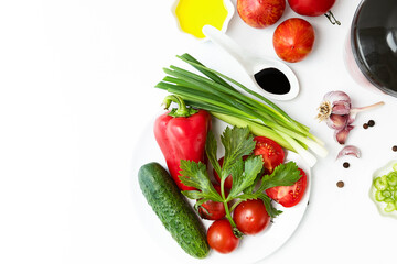 Vegetables on a white faded background. the process of preparing Spanish cold gazpacho soup. concept of the harvest season