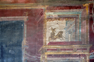 Ancient Pompei fresco of a winged soldier on a chariot. Pompeii was destroyed by the volcanic eruption of Vesuvius in 79 BC