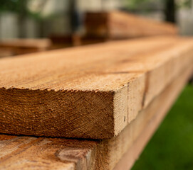 Cedar wood planks being cut for pergola. 