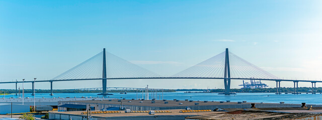 Ravenel Bridge, seen from downtown Charleston, with the Wando River Bridge and Wando Welch Terminal in the background.