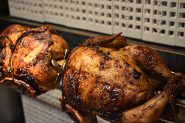 Fresh Cooked Rotisserie Chicken Still Inside the Rotisserie