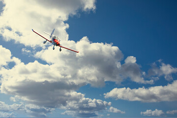 Fototapeta na wymiar Small planes in the clouds over Bronnoysund airport