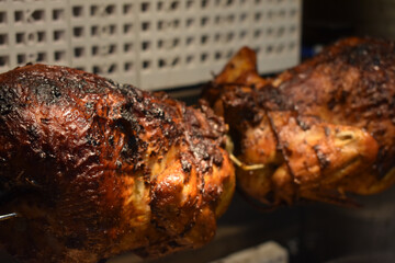 Fresh Cooked Rotisserie Chicken Still Inside the Rotisserie
