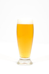 A glass of beer filled with foam centered in the image with a white background.