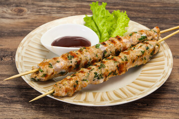 Minced pork skewer kebab with sauce