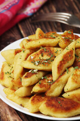 Polish dish kopytka served at the table