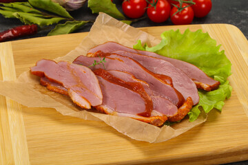 Sliced smoked duck breast served salad
