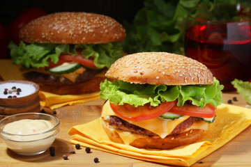 Two fresh hamburgers with vegetables