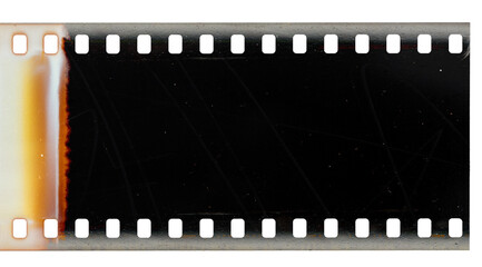 Burnt start of 35mm negative filmstrip, first dark frame on white background, real scan of film...