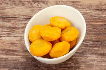 Marinated yellow patisson in the bowl