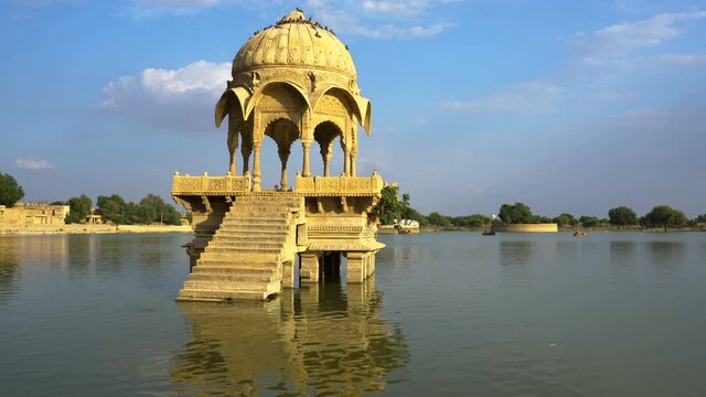 Beautiful structures made of yellow stone amidst water body, Gadisar lake in the beautiful city of Jaisalmer, was artificially built for water conservation. Shot at Jaisalmer, Rajasthan, India