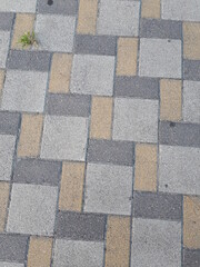 Paving slabs of gray, yellow colors. Courtyard and street design. Construction, renovation.