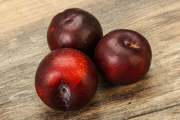 Ripe sweet plum fruit heap