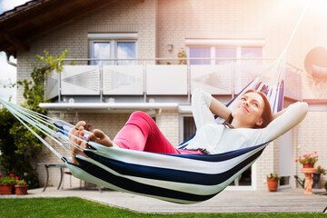 Woman In Comfort Hammock Outdoors Relaxing