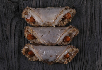 nut cookies isolated on black wooden background