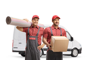 Workers from a moving company with a box and carpet in front of a white van