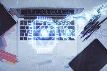 Multi exposure of data drawing hologram over topview of study desk background with computer. Concept of technology.