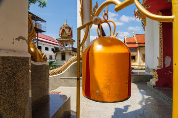 Fototapeta na wymiar Bell at the entrance to the Buddhist temple of Wat Wichit Songkram.