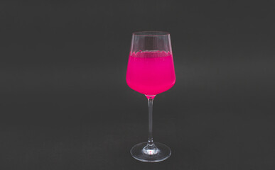 Pink drink in wine glass