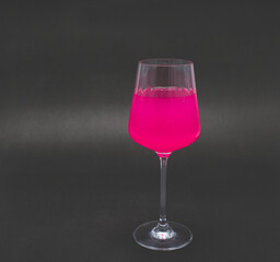 Pink drink in wine glass