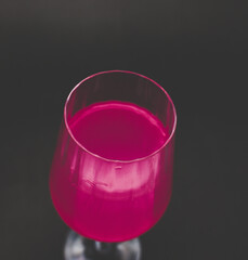 Pink drink in wine glass