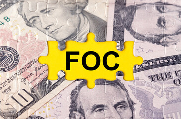 Puzzle with the image of dollars in the center of the inscription -FOC