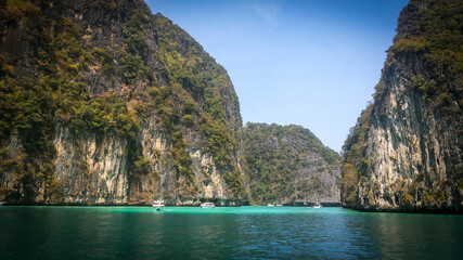 Boat in Ao nang bay, Thailand. High cliff, great rock