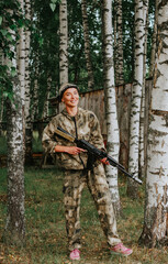 Girl playing in lasertag shooting game, girl with a gun, war simulation.