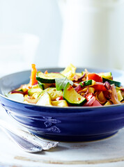 Pappardelle Pasta with Vegetables and fresh Basil on bright wooden Background.	