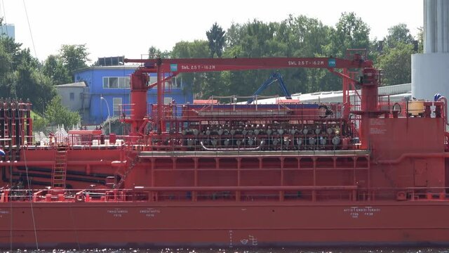 Schleswig-Holstein, Kiel, Germany - August 08 2020: Big red oil and chemical ship called Annette Essberger passing by in the Kiel Canal