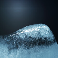 Closeup of cracked ice texture on an ice cube. Studio macro shot.