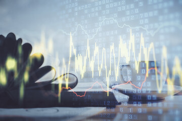 Double exposure of financial chart drawing and desktop with coffee and items on table background. Concept of forex market trading
