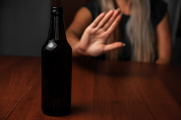 Young woman alcoholic social problems concept sitting refusal of alcohol