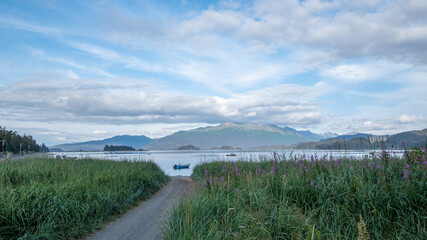 Mountain view and fishing boat from MacDonald Spit near Homer, Alaska