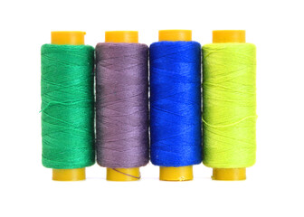 Spool of coloured thread isolated on white background. 