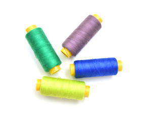 Spool of coloured thread isolated on white background. 