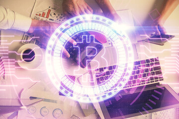 Double exposure of man and woman working together and crypto theme hologram drawing. Computer background. Blockchain concept. Top View.