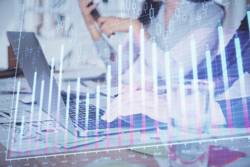 Multi exposure of woman hands typing on computer and forex chart hologram drawing. Stock market analysis concept.