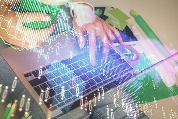 Double exposure of woman hands typing on computer and forex chart hologram drawing. Stock market invest concept.