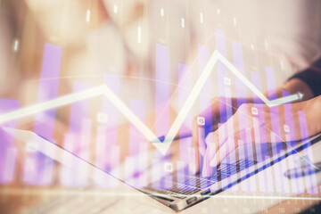 Double exposure of woman hands typing on computer and forex chart hologram drawing. Stock market invest concept.