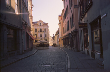 Fototapeta na wymiar Panoramic view of the central streets of Tallinn on a summer morning in Estonia. Real grain scanned film.